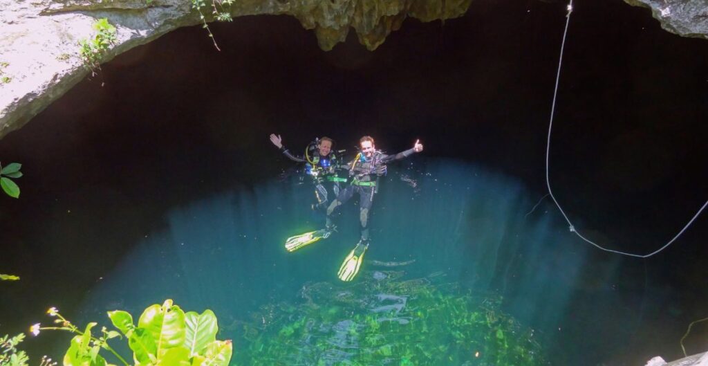 underwater cave exploration in Cenote Calavera Tulum , Mexico